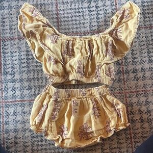 Kate Quinn Yellow and Purple Floral Outfit